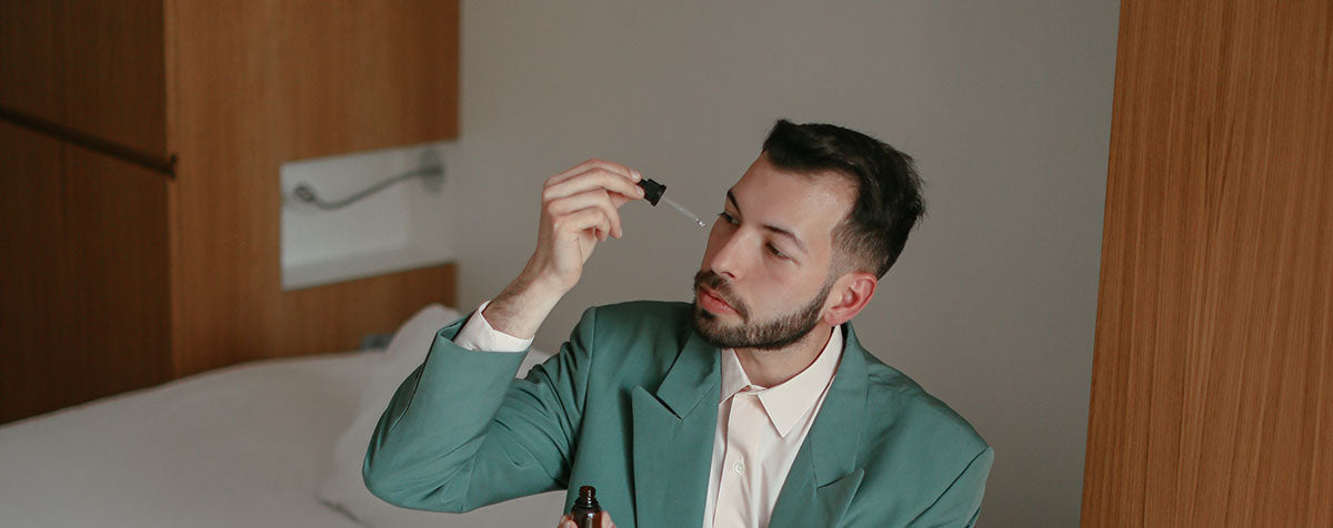 Man Applying Beard Oil to His Beard