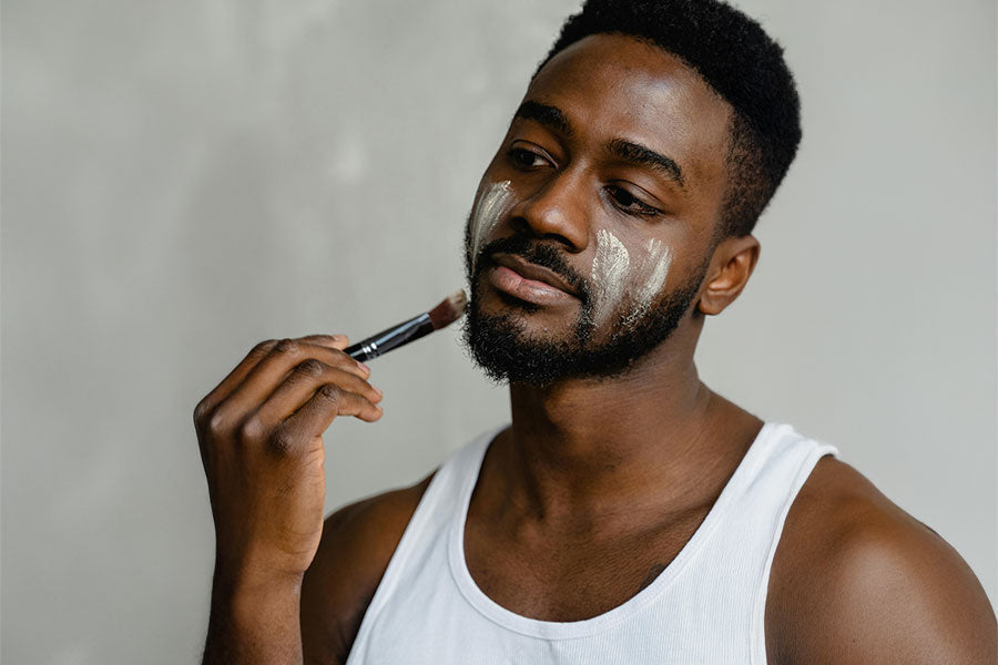 man with beard applying korean skincare