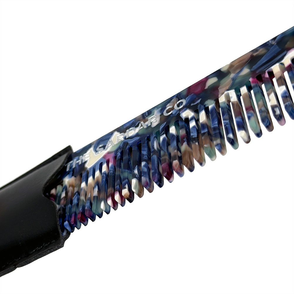 Close up of multicoloured acetate hair comb