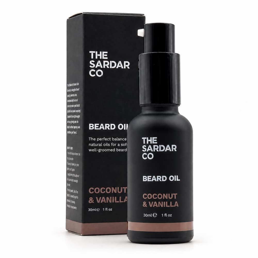 A bottle of The Sardar Co Beard Oil Coconut & Vanilla scent next to its black packaging box, displayed on a clean white background.