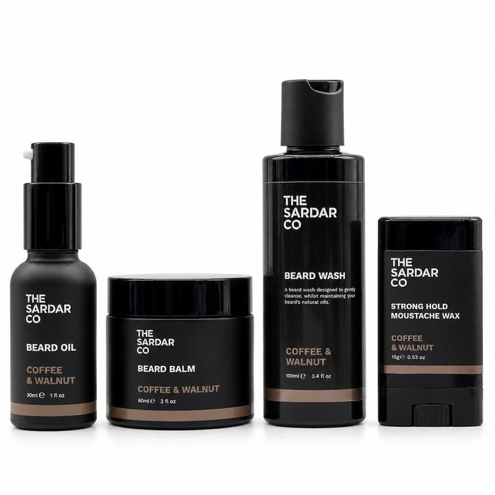 Four beard grooming products from The Sardar Co in a matching matte black and coffee &amp; walnut colorway, arranged on a clean white background.