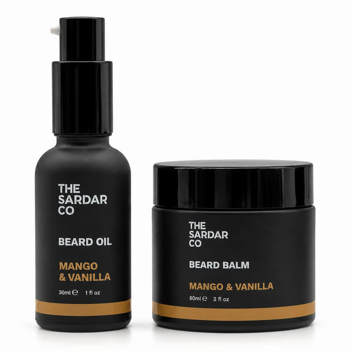 A beard care set from The Sardar Co, featuring a black pump bottle of Mango &amp; Vanilla Beard Oil and a matching black jar of Mango &amp; Vanilla Beard Balm, set against a plain white background.
