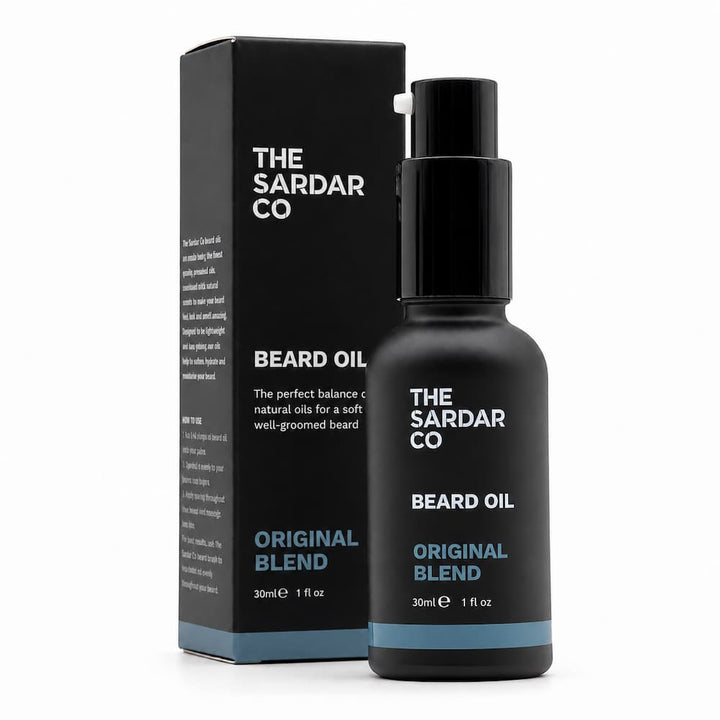 A bottle of The Sardar Co Beard Oil next to its black packaging box, both featuring white and light blue text on a clean white background.