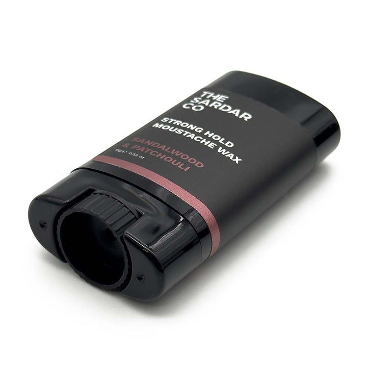 Black container of The Sardar Co moustache wax on a white background