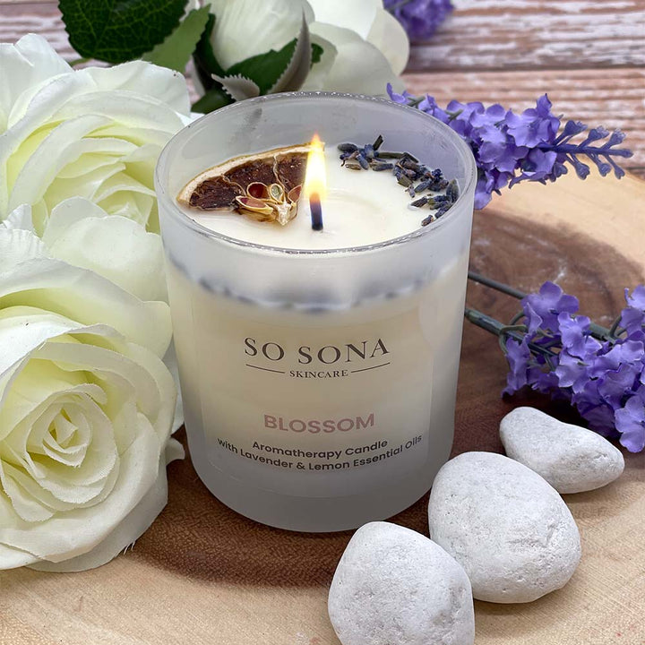 Blossom scented candle lit