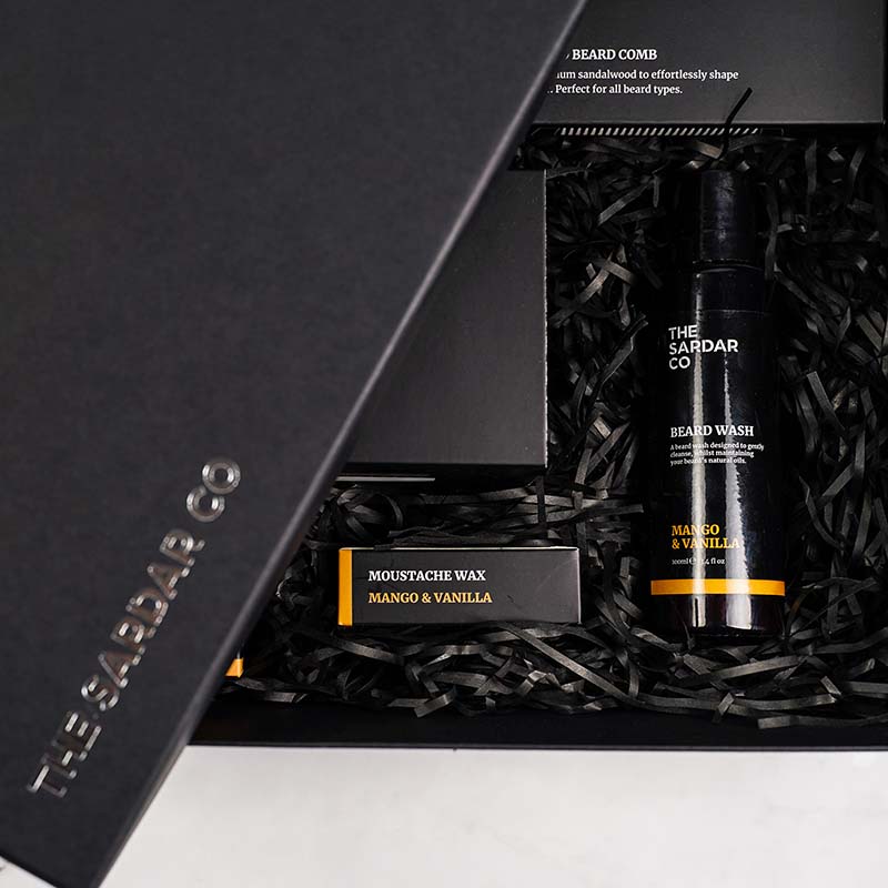 ultimate-gift-set-mango-and-vanilla-packed-with-shredded-paper-closeup