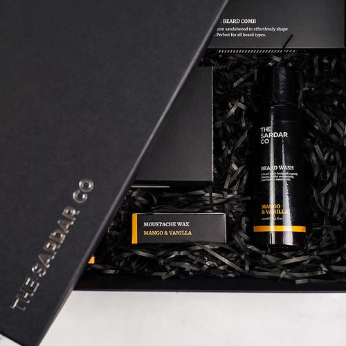 ultimate-gift-set-mango-and-vanilla-packed-with-shredded-paper-closeup